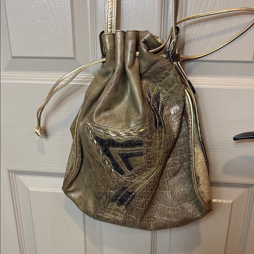 Gold and Black Backpack with Luxurious Metallic Finish